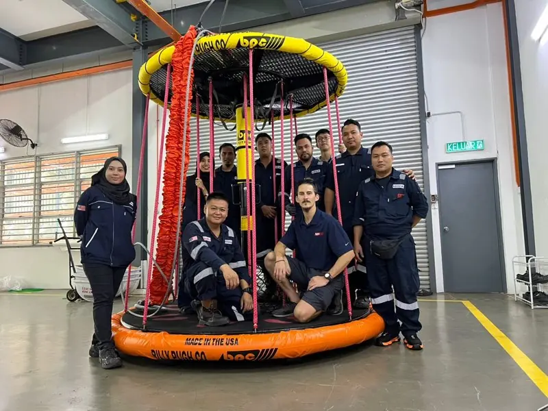 Training class standing in an X-904 after completing the course